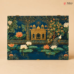 A rectangular decorative box with a detailed Indian-inspired print featuring a golden palace, peacock, lotus flowers, and trees on a deep blue background, photographed against a warm beige backdrop. The Bakeey brand logo is visible in the top right corner.