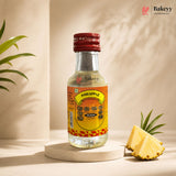 Bottle of Bakeyy Pineapple Bush with a pineapple wedge on a neutral background