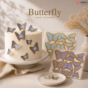 Butterfly cake toppers on a cake and packaging with 'Bakeyy' branding.
