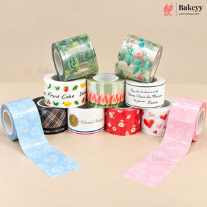 A collection of decorative washi tapes in various colors and patterns, including fruit, hearts, flames, and French text, arranged on a beige background with the Bakeyy brand logo visible.