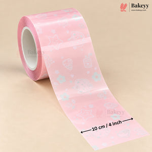 Pink decorative tape roll with white and light blue bakery-themed illustrations, shown unrolled on a beige background with a 10 cm / 4 inch dimension marker. Bakeyy branding is visible.