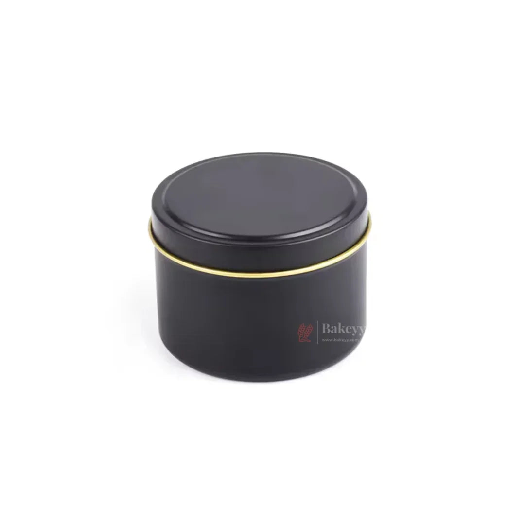 Black round candle tin box with gold rim, gift packaging at Bakeyy wholesale store
