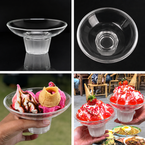 Clear glass dessert bowls with ice cream and fruit toppings, set against a dark background.