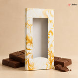 Chocolates in a decorative box with marbled design on a beige background