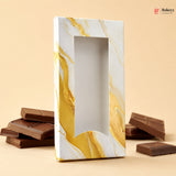Marble-patterned chocolate box with chocolate bars on a beige background