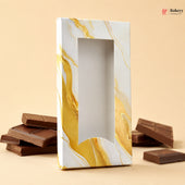 Marble-patterned chocolate box with chocolate bars on a beige background