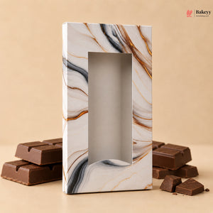 Marble-patterned chocolate box with chocolate bars on a beige background