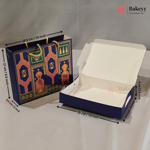 A navy blue bakery gift bag and matching open cardboard box with printed ornate arch motifs, shown on a white surface with dimension arrows and labels. The Bakeyy logo appears in the top right.