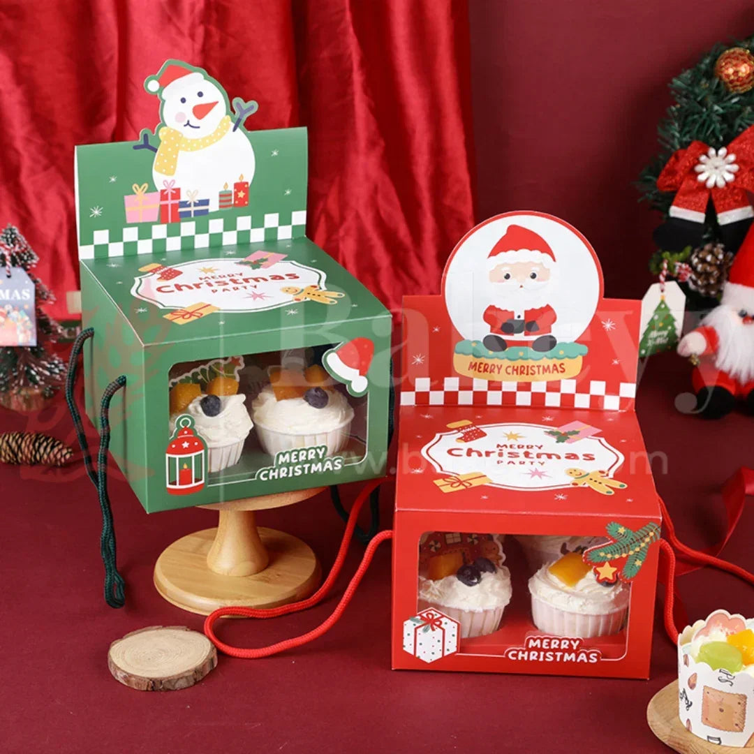 Christmas-themed cupcake boxes with Santa Claus design on a red background