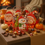 Christmas-themed candy packages with Santa Claus and snowman designs on a table with decorative items.