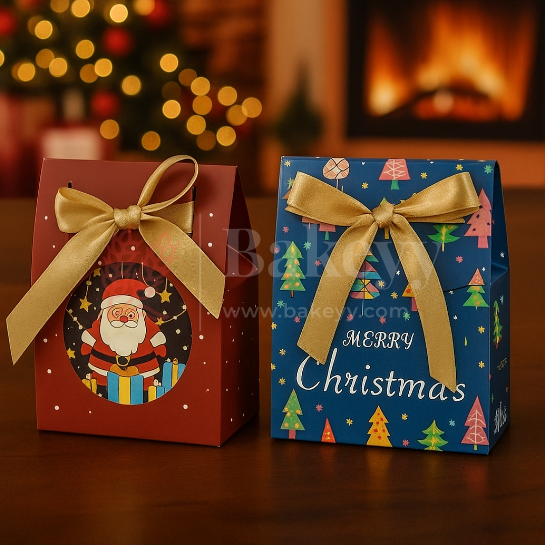 Two Christmas-themed gift boxes with Santa Claus and colorful trees on a wooden surface.
