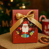 Red gift box with Santa Claus design and gold ribbon on a festive background
