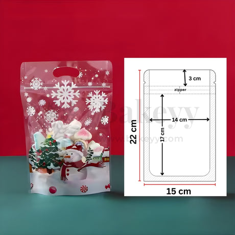 Christmas-themed stand-up pouch with snowflakes and a snowman design, next to its dimensions on a red and blue gradient background.