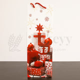 Decorative gift bag with red and white polka dot presents, Christmas balls, and a star on a white background.