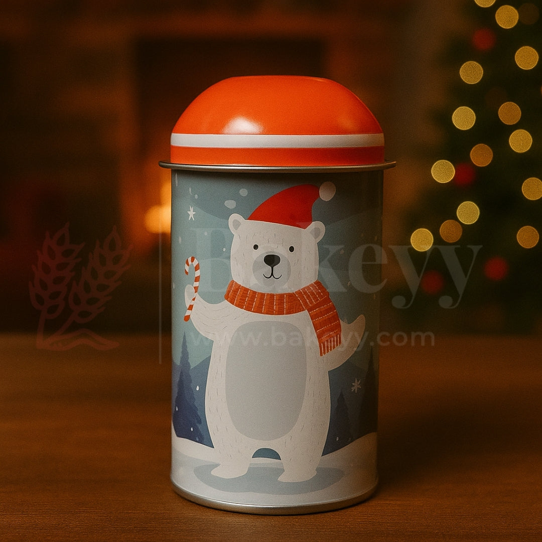 Decorative tin can with a polar bear design and red lid, set against a warm, blurred background.