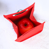 Red fabric bag with a tomato inside on a white background, featuring the brand 'Bakeyy'.