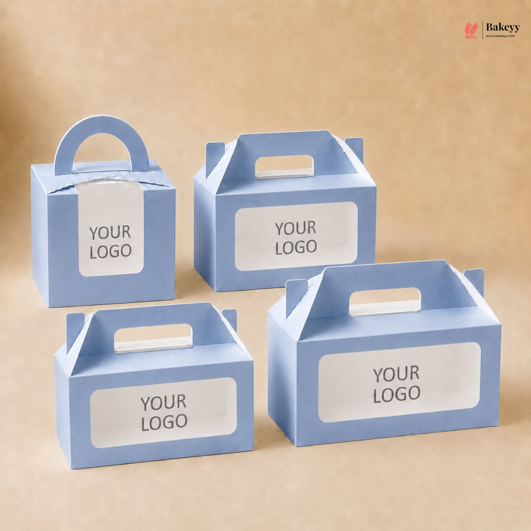 Four blue cardboard boxes with handle and customizable 'YOUR LOGO' label on a beige background.