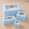 Set of light blue boxes with 'YOUR LOGO' text on a beige background