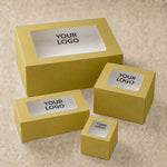 Set of yellow boxes with 'YOUR LOGO' text on a beige background
