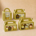 Four green cupcake boxes with clear windows displaying cupcakes on a beige background
