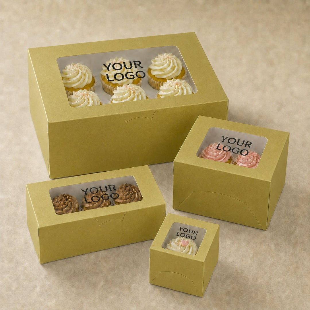 Set of yellow cake boxes with clear windows for displaying cupcakes on a beige background