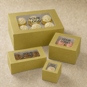 Set of yellow cake boxes with clear windows for displaying cupcakes on a beige background