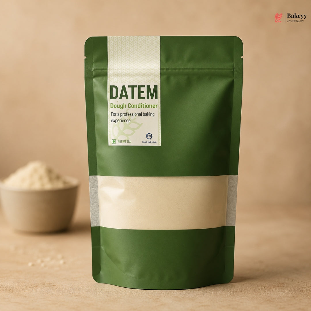 Green package of Datem Dough Conditioner with a beige label on a wooden surface.