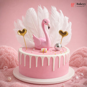 Pink cake with flamingo decoration on a pink background