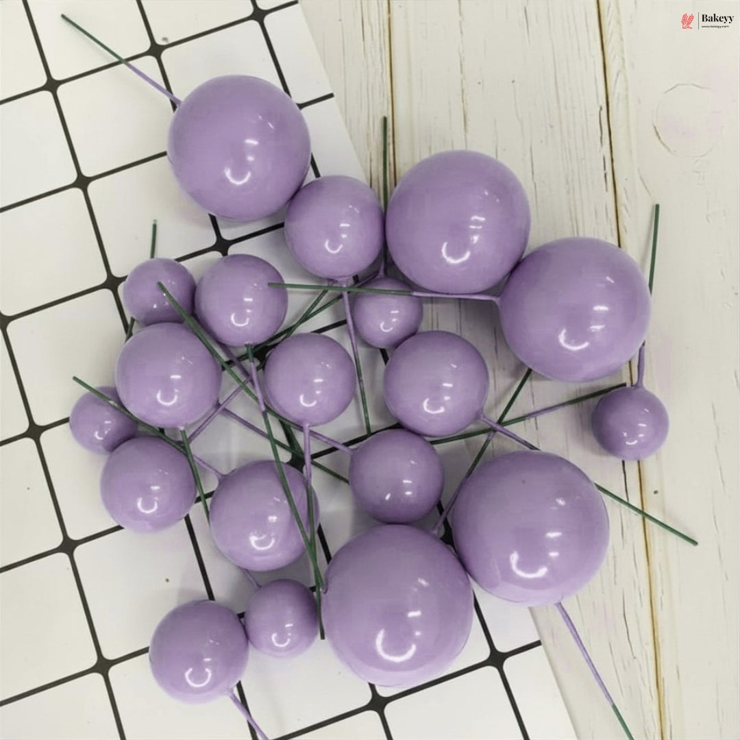 Purple spherical decorations on a white and black grid background