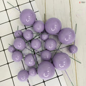Purple spherical decorations on a white and black grid background