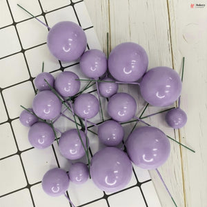 Purple spherical decorations on a white and black grid background