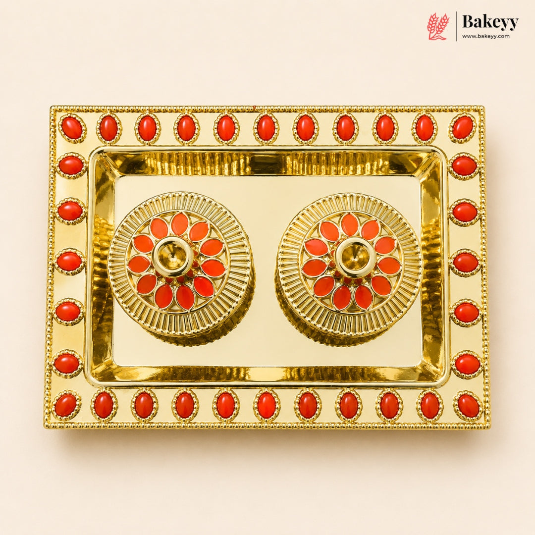 Decorative gold tray with red stones on a beige background, featuring the Bakeyy brand.