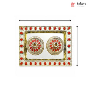 Decorative tray with red stones and gold accents on a white background, branded 'Bakeyy'.