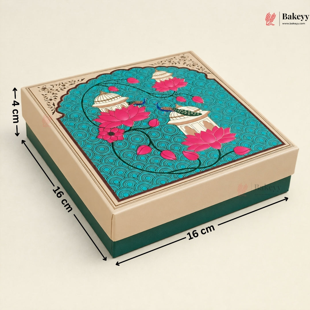 A square decorative gift box shown at an angle on a light beige background, with dimension arrows and labels indicating 16 cm by 16 cm by 4 cm. The lid features a turquoise pattern with pink lotus flowers, cream domed motifs, and a beige border.