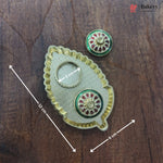 Decorative metal item with measurements on a wooden surface, featuring the brand 'Bakeyy'.
