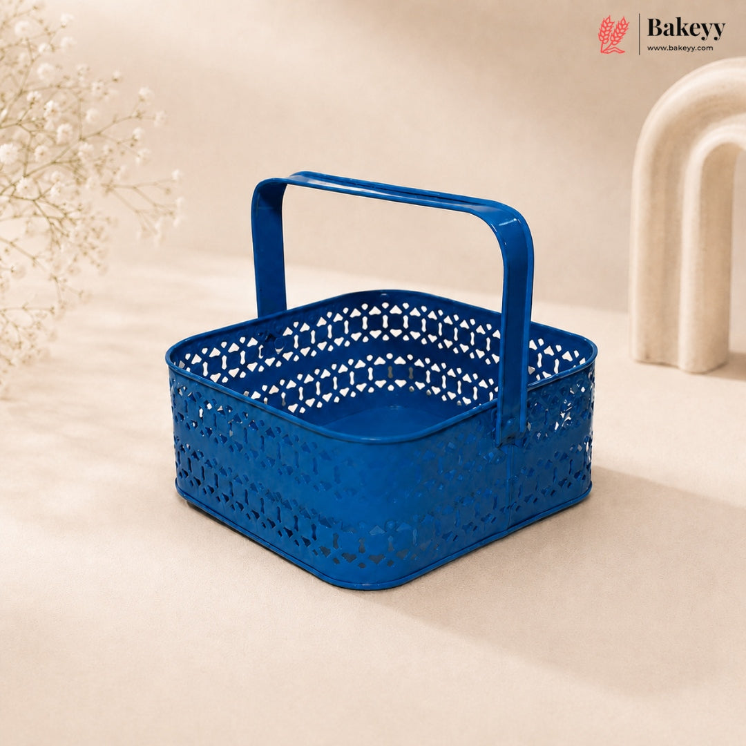 Blue perforated basket with handle on a beige background, featuring the Bakeyy brand.