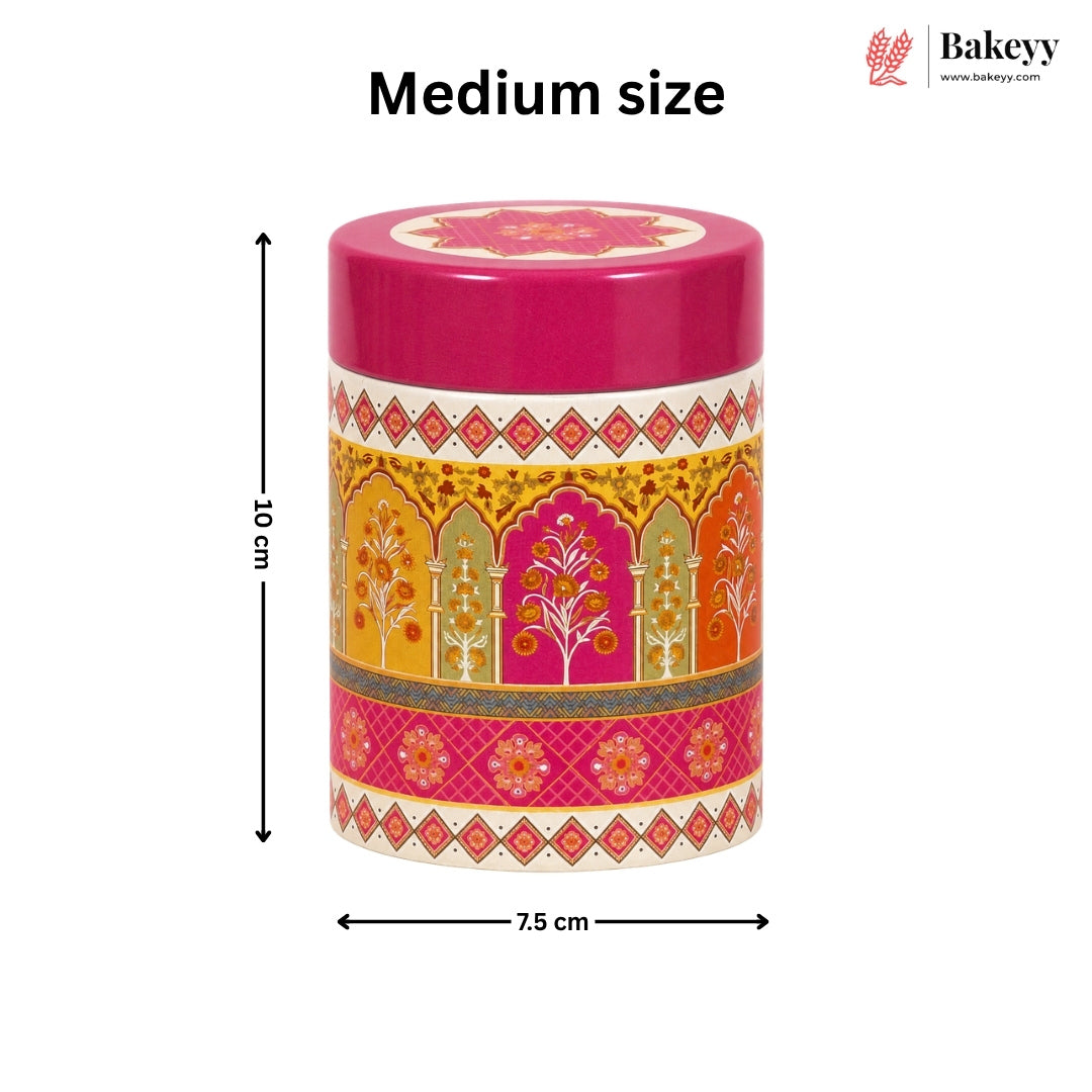 A medium-sized cylindrical container with a bright pink lid and a colorful ornate patterned body, shown on a white background with dimension arrows indicating 8 cm height and 7.5 cm width.