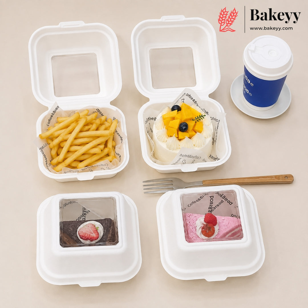 Four white square food containers with clear lids are arranged on a beige background. Two containers are open, showing golden fries and a white dessert topped with mango and blueberries inside printed paper liners; the other two containers are closed, displaying printed dessert photos on the clear lids.
