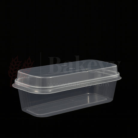 Clear plastic food container with lid on a black background