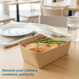 Takeout container with food on a table with a blurred background