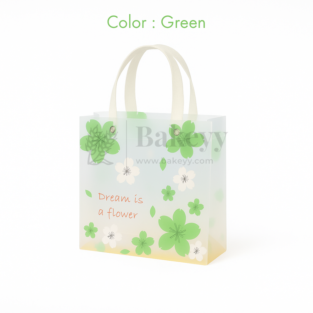 Small green floral gift bag with decorative elements on a white background