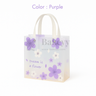 Purple floral gift bag with 'bakeyy' branding and text on a white background