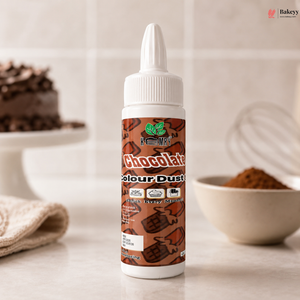 Bottle of chocolate color dust on a kitchen counter with baking ingredients in the background