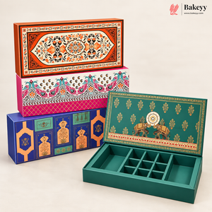 Four decorative rectangular baking boxes with intricate hand-painted traditional patterns in orange, pink, blue, and green, with one box shown open to reveal a divided interior tray compartment, set against a clean off-white background.