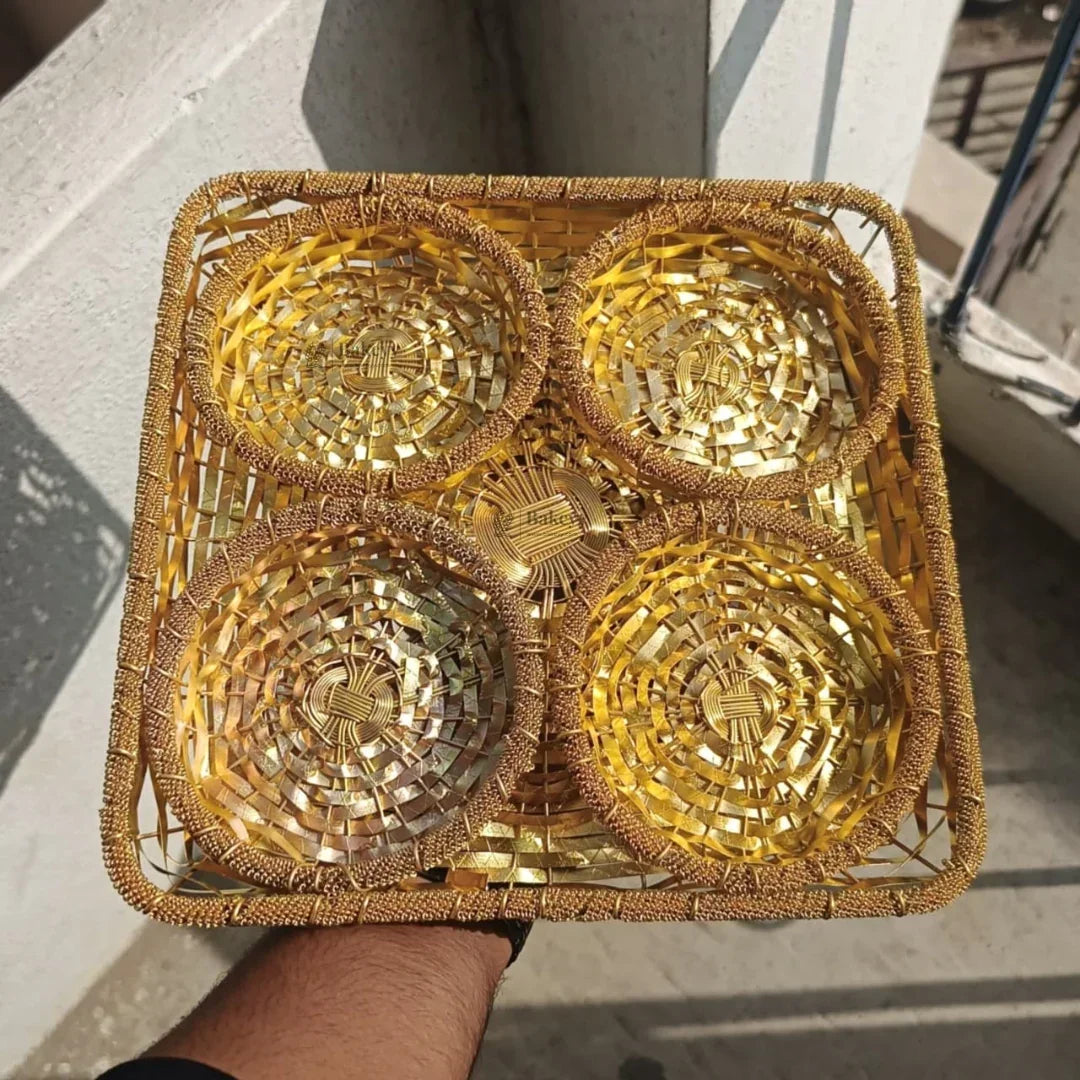 Golden woven dry fruits tray with four round compartments, ideal for gift hampers from Bakeyy.com