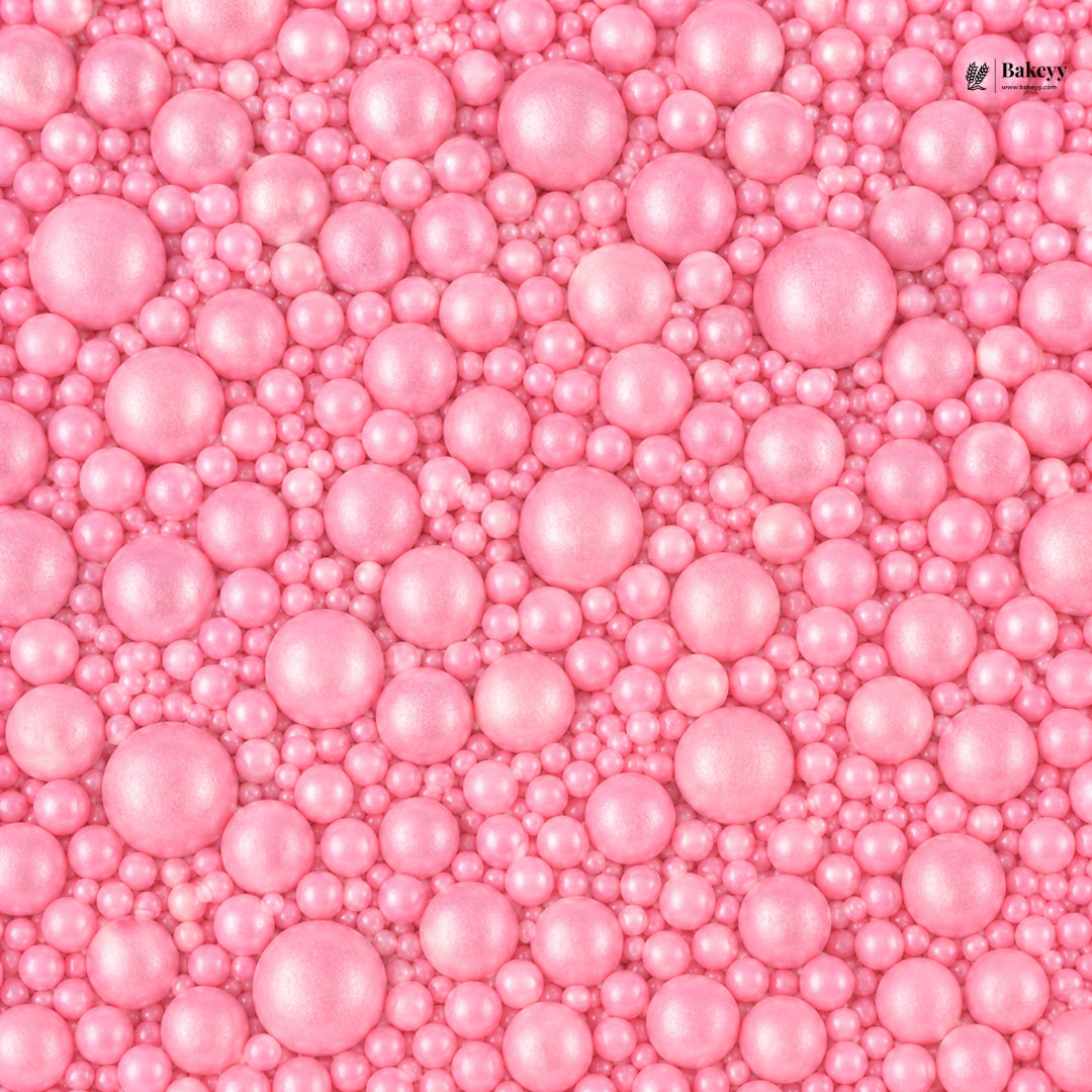 Pink pearl-like beads with a visible brand logo in the corner.