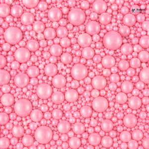 Pink pearl-like beads with a visible brand logo in the corner.