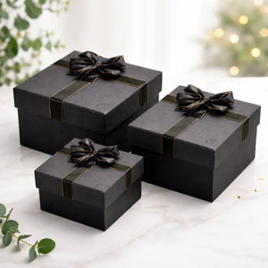 Elegant black and grey gift boxes with ribbons, ideal for hamper and gift packaging from Bakeyy