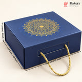 A dark blue rectangular gift box with a gold mandala design on the lid and a gold rope handle, shown with dimension lines indicating 28.5 cm by 30.