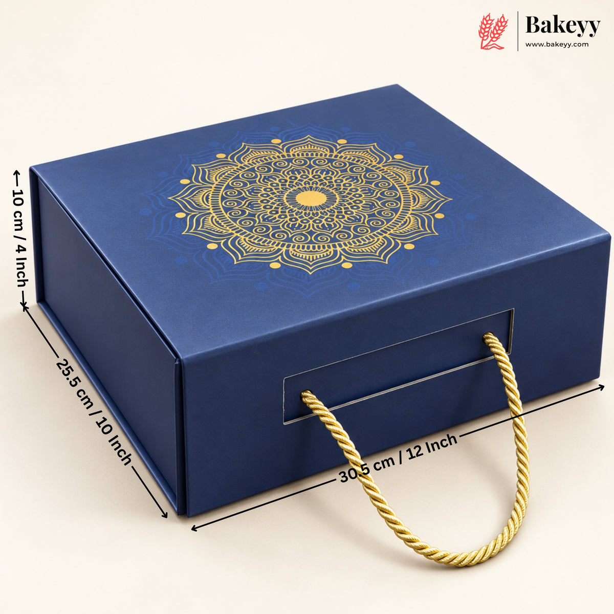 A dark blue rectangular gift box with a gold mandala design on the lid and a gold rope handle, shown with dimension lines indicating 28.5 cm by 30.